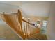 View from the staircase of the living room with a fireplace and natural light at 235 Rustic Mill Ln, Fayetteville, GA 30214