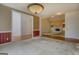Open-concept living area featuring hardwood floors, fireplace, and carpeted floors at 235 Rustic Mill Ln, Fayetteville, GA 30214