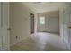 Room with tile flooring, featuring multiple doors and natural light at 235 Rustic Mill Ln, Fayetteville, GA 30214