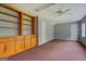 Room with built-in shelving and carpeted floors at 235 Rustic Mill Ln, Fayetteville, GA 30214