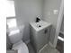 Updated bathroom with a modern vanity, sleek fixtures, and white toilet at 295 Lamden Ct, Lawrenceville, GA 30046