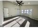 Bedroom featuring carpet, ceiling fan, sliding barn door and bay window at 295 Lamden Ct, Lawrenceville, GA 30046