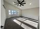 Bedroom featuring carpet, ceiling fan and plenty of light at 295 Lamden Ct, Lawrenceville, GA 30046