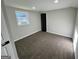 Bedroom with neutral walls, plush carpet, closet and window for natural light at 295 Lamden Ct, Lawrenceville, GA 30046
