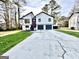 Charming two-story home with two-car garage and nicely manicured lawn at 295 Lamden Ct, Lawrenceville, GA 30046
