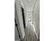 Bright hallway illuminated by natural light streaming through the front door with wood flooring at 295 Lamden Ct, Lawrenceville, GA 30046