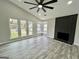Bright living room with hardwood floors, fireplace, ceiling fan and natural light at 295 Lamden Ct, Lawrenceville, GA 30046