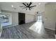 Spacious living room with modern flooring, fireplace, and sliding glass doors to deck at 295 Lamden Ct, Lawrenceville, GA 30046