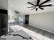 Spacious living room featuring large ceiling fans, modern flooring, and great natural light at 295 Lamden Ct, Lawrenceville, GA 30046