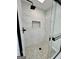 Shower featuring pebble floor and tiled walls at 295 Lamden Ct, Lawrenceville, GA 30046