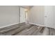 Neutral bedroom features wood-look floors and fresh paint at 770 Four Winds Ln, Jonesboro, GA 30238