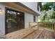 Home's wood deck features a sliding glass door entry and wooden railings at 770 Four Winds Ln, Jonesboro, GA 30238