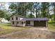 Two-story home featuring neutral siding, covered porch, attached garage, and concrete driveway at 770 Four Winds Ln, Jonesboro, GA 30238