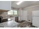 Kitchen featuring neutral walls, luxury vinyl flooring, white cabinets, and stainless steel appliances at 770 Four Winds Ln, Jonesboro, GA 30238