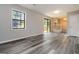 Living room with neutral walls, luxury vinyl flooring, natural light, and deck access at 770 Four Winds Ln, Jonesboro, GA 30238