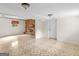 Large basement featuring tile flooring, brick fireplace, and access to other areas, great for entertaining at 8310 Meridian Dr, Riverdale, GA 30274