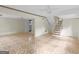 Open basement area with a staircase and tile flooring, providing ample potential for customization at 8310 Meridian Dr, Riverdale, GA 30274