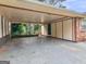Spacious carport area, providing ample covered parking and featuring convenient access to the home's entrance at 8310 Meridian Dr, Riverdale, GA 30274