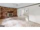 Cozy living room with brick fireplace and tile flooring at 8310 Meridian Dr, Riverdale, GA 30274