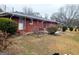 View of the spacious backyard with mature trees offering an outdoor space at 500 Circle Dr, Fayetteville, GA 30214
