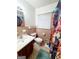 Bathroom with patterned shower curtain, sink and drawers, and patterned floors at 500 Circle Dr, Fayetteville, GA 30214