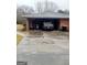 Carport with stone accents, a vehicle, and access to the home's exterior at 500 Circle Dr, Fayetteville, GA 30214