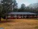 Charming brick home with well-maintained lawn and mature trees adding to its curb appeal at 500 Circle Dr, Fayetteville, GA 30214
