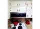 Kitchen with white cabinets, microwave, and sleek appliances offers essential amenities for cooking at 500 Circle Dr, Fayetteville, GA 30214