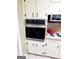 Kitchen featuring built-in oven and microwave, providing cooking convenience with appliances at 500 Circle Dr, Fayetteville, GA 30214