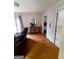 Comfortable living room with wood flooring, neutral walls, and bright natural light at 500 Circle Dr, Fayetteville, GA 30214
