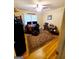 Home office with hardwood floors, ceiling fan, and a workspace set up with dual monitors at 500 Circle Dr, Fayetteville, GA 30214