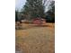 Exterior view of the outbuilding with a ample yard for storage and hobbies at 500 Circle Dr, Fayetteville, GA 30214