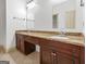 Bathroom with double sinks, granite countertops, and ample cabinet space at 187 Vanira Se Ave, Atlanta, GA 30315