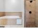 Bathroom with jacuzzi tub and tiled stand-up shower at 187 Vanira Se Ave, Atlanta, GA 30315