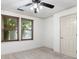 Bedroom with window view of the outside and ceiling fan with lighting at 187 Vanira Se Ave, Atlanta, GA 30315