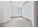 Empty room with light-filled and neutral carpet flooring at 187 Vanira Se Ave, Atlanta, GA 30315