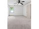 Bright bedroom featuring plush carpeting, a modern ceiling fan, and natural light from a window at 187 Vanira Se Ave, Atlanta, GA 30315