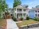 Charming two-story home with inviting double porches and well-maintained landscaping at 187 Vanira Se Ave, Atlanta, GA 30315