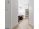 Hallway with tile flooring leading to a bathroom with a vanity and mirror at 187 Vanira Se Ave, Atlanta, GA 30315