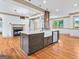 Kitchen island featuring stone countertops, stainless steel appliances, and open to the living space at 187 Vanira Se Ave, Atlanta, GA 30315