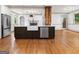 Kitchen island with farmhouse sink, stainless steel dishwasher, and open to living spaces at 187 Vanira Se Ave, Atlanta, GA 30315