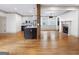 Spacious living room featuring hardwood floors, fireplace, modern lighting, and open design at 187 Vanira Se Ave, Atlanta, GA 30315
