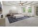 Spacious main bedroom features a tray ceiling, sitting area, and carpet flooring at 187 Vanira Se Ave, Atlanta, GA 30315