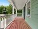 Inviting outdoor porch featuring wooden flooring and stylish railing at 187 Vanira Se Ave, Atlanta, GA 30315