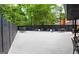 Large deck with an outdoor seating area and black privacy fence at 2401 Ne Greenglade Rd, Atlanta, GA 30345