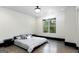 Bright bedroom boasts hardwood floors, and a serene view from the spacious window at 2401 Ne Greenglade Rd, Atlanta, GA 30345