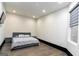 Spacious bedroom features wood floors, recessed lighting, and a gray upholstered bed at 2401 Ne Greenglade Rd, Atlanta, GA 30345
