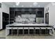 Contemporary kitchen featuring a large island, modern stools, and sleek black and white cabinetry at 2401 Ne Greenglade Rd, Atlanta, GA 30345