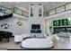 Expansive living area featuring soaring ceilings, elegant decor, and abundant natural light at 2401 Ne Greenglade Rd, Atlanta, GA 30345