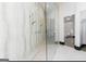 Stylish shower with marble wall, and glass panel at 2401 Ne Greenglade Rd, Atlanta, GA 30345